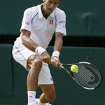 
              Novak Djokovic of Serbia returns a ball to  Bernard Tomic of Australia during their singles match at the All England Lawn Tennis Championships in Wimbledon, London, Friday July 3, 2015. (AP Photo/Kirsty Wigglesworth)
            
