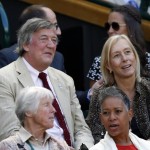 
              British comedian and actor Stephen Fry, centre left, sits with Former Wimbledon champion Martina Navratilova in the Royal Box on Centre Court, ahead of the women's semifinal matches, at the All England Lawn Tennis Championships in Wimbledon, London, Thursday July 9, 2015. (AP Photo/Alastair Grant)
            