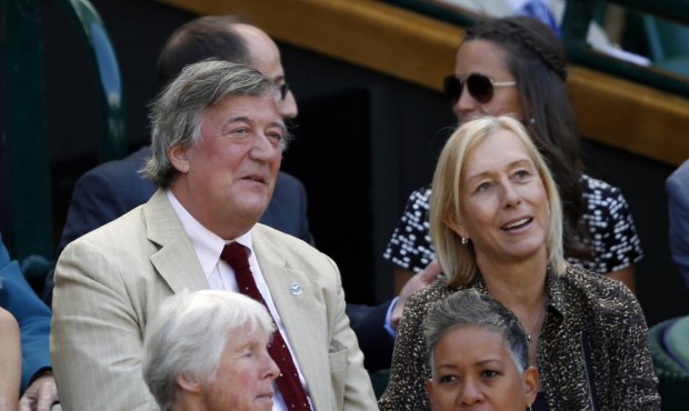 British comedian and actor Stephen Fry, centre left, sits with Former Wimbledon champion Martina Na...