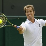 
              Richard Gasquet of France makes a return to  Nick Kyrgios of Australia during their singles match at the All England Lawn Tennis Championships in Wimbledon, London, Monday July 6, 2015. (AP Photo/Kirsty Wigglesworth)
            