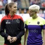 
              Seattle Reign forward Megan Rapinoe, right, stands next to Portland Thorns forward Alex Morgan before an NWSL soccer match in Portland, Ore., Wednesday, July 22, 2015. Seattle won 1-0. Morgan, who is recovering from surgery on her right knee, did not play. (AP Photo/Don Ryan)
            