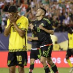 
              Mexico's Oribe Peralta (19) celebrates after scoring a goal past Jamaica's Joel McAnuff (10) during the second half of the CONCACAF Gold Cup championship soccer match, Sunday, July 26, 2015, in Philadelphia. (AP Photo/Matt Rourke)
            