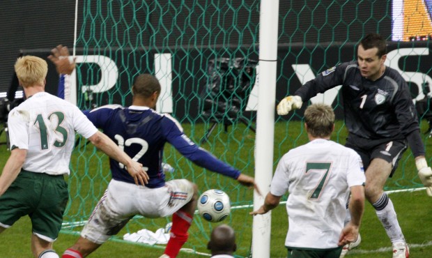 File – France’s Thierry Henry, left, passes the ball as Ireland’s goalkeeper Shay...