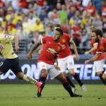 
              Club America's Osvaldo Martinez, left, moves the ball away from Manchester United forward Memphis Depay, second fem left, duriong the first half of an international friendly soccer match, Friday, July 17, 2015, in Seattle. (AP Photo/Ted S. Warren)
            