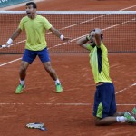 
              Croatia's Ivan Dodig, left, and Brazil's Marcelo Melo celebrate as they defeat Bob and Mike Bryan of the U.S. in their men's doubles final match of the French Open tennis tournament at the Roland Garros stadium, Saturday, June 6, 2015 in Paris. Dodig and Melo won 6-7, 7-6, 7-5.  (AP Photo/Michel Euler)
            