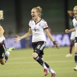 
              Germany's Leonie Maier (4), Simone Laudehr (6) and Melanie Behringer (7) react after defeating France on penalty kicks in a quarterfinal match in the FIFA Women's World Cup soccer tournament, Friday, June 26, 2015, in Montreal, Canada. (Ryan Remiorz/The Canadian Press via AP) MANDATORY CREDIT
            