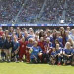 
              United States’ players and their mother's pose for a photo during the announcements before the start of the match against Ireland in a exhibition soccer match Sunday, May 10, 2015, in San Jose, Calif. The team was celebrating Mother's Day. (AP Photo/Tony Avelar)
            