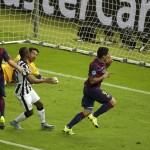
              Barcelona's Luis Suarez, right, scores his side's 2nd goal during the Champions League final soccer match between Juventus Turin and FC Barcelona at the Olympic stadium in Berlin Saturday, June 6, 2015. (AP Photo/Michael Sohn)
            