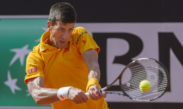Serbia’s Novak Djokovic returns the ball to Spain’s Nicolas Almagro during their match ...