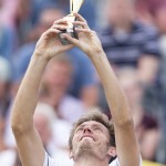 
              Nicolas Mahut of France holds the trophy after winning the men's final match against David Goffin of Belgium at the open grass court tournament in Rosmalen, central Netherlands, Sunday, June 14, 2015. (AP Photo/Ermindo Armino)
            