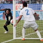 
              Guatemala goalkeeper Paulo Motta, left, reaches for an own goal by Carlos Castrillo, not seen, as defender Ruben Morales (2) watches during the first half of an international friendly soccer match against the United States on Friday, July 3, 2015, in Nashville, Tenn. (AP Photo/Mark Humphrey)
            