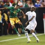 
              Jamaica’s Joel McAnuff (10) heads the ball in front of United States’ Gyasi Zardes (20) during the first half of a CONCACAF Gold Cup soccer semifinal Wednesday, July 22, 2015, in Atlanta. (AP Photo/John Bazemore)
            