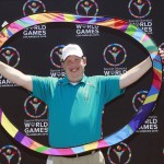 
              In this Thursday, July 16, 2015, photo, former Special Olympics athlete and coach Dustin Plunkett poses with the Special Olympics' Circle of Inclusion in Carson, Calif. Plunkett is helping organize this year Special Olympics World Games in Los Angeles, which will feature thousands of athletes from over 100 countries competing in more than two dozen sports when it begins next week. (AP Photo/Nick Ut)
            