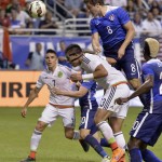 
              FILE - In this April 15, 2015, file photo, United States forward Jordan Morris (8) heads the ball at goal over Mexico's Carlos Salcedo (13) during the first half of an international friendly soccer match in San Antonio. Morris has Type 1 diabetes, so getting the symbol for his disease inked on his right forearm serves dual purposes: as medical identification if needed and also as a reminder to the Stanford star what he has endured to become a contributor for the U.S. men's national team at age 20. Not that he intended to ever do it. (AP Photo/Darren Abate, File)
            