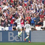 
              United States' Carli Lloyd (10) and Megan Rapinoe celebrate Lloyd's goal against Japan during first half action in the FIFA Women's World Cup soccer championship in Vancouver, British Columbia, Canada, Sunday, July 5, 2015.   (Jonathan Hayward/The Canadian Press via AP) MANDATORY CREDIT
            