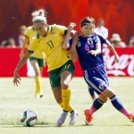 
              Australia's Kyah Simon, left, fights off a challenge by Japan's Nahomi Kawasumi during the second half of a FIFA Women's World Cup quarter-final soccer match in Edmonton, Alberta, Canada, Saturday, June 27, 2015. (Jeff McIntosh/The Canadian Press via AP) MANDATORY CREDIT
            