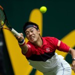 
              Kei Nishikori of Japan returns the ball to Austria's Dominic Thiem during their first round match at the Gerry Weber Open tennis tournament in Halle, Germany, Tuesday, June 16, 2015. (Maja Hitij/dpa via AP)
            