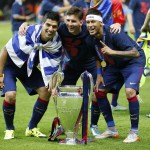 
              Barcelona's Lionel Messi, centre, Neymar and Luis Suarez, left, celebrate with the trophy after after the Champions League final soccer match between Juventus Turin and FC Barcelona at the Olympic stadium in Berlin Saturday, June 6, 2015. Barcelona won the match 3-1.  (AP Photo/Frank Augstein)
            