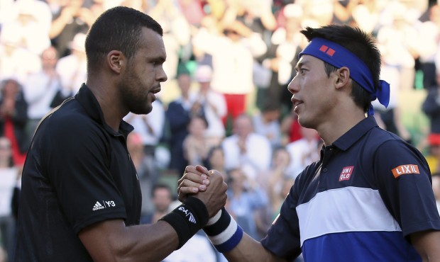 France’s Jo-Wilfried Tsonga shakes hands with Japan’s Kei Nishikori after winning in th...