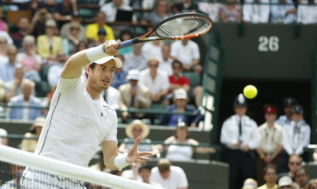 Andy Murray of Britain returns a ball to Robin Haase of the Netherlands, during their singles match...