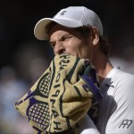 
              Andy Murray of Britain wipes his face with a towel after losing the 2nd set against Roger Federer of Switzerland during the men's singles semifinal match at the All England Lawn Tennis Championships in Wimbledon, London, Friday July 10, 2015. (Toby Melville/Pool Photo via AP)
            
