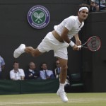 
              Roger Federer of Switzerland serves to Gilles Simon of France during their singles match at the All England Lawn Tennis Championships in Wimbledon, London, Wednesday July 8, 2015. (AP Photo/Pavel Golovkin)
            