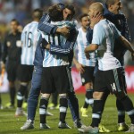 
              Argentina's Lionel Messi celebrates with teammates after the penalty shootout during a Copa America quarterfinal soccer match at the Sausalito Stadium in Vina del Mar, Chile, Friday, June 26, 2015. Argentina defeated Colombia 5-4 on penalties after a 0-0 draw on Friday to reach the semifinals of the Copa America.(AP Photo/Andre Penner)
            