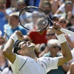 
              Novak Djokovic of Serbia celebrates defeating Philipp Kohlschreiber of Germany in their men's singles first round match at the All England Lawn Tennis Championships in Wimbledon, London, Monday June 29, 2015. Djokovic won the match 6-4, 6-4, 6-4. (AP Photo/Kirsty Wigglesworth)
            