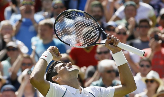 Novak Djokovic of Serbia celebrates defeating Philipp Kohlschreiber of Germany in their men’s...
