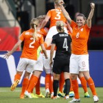 
              Netherlands' Sherida Spitse (8) celebrates her team's goal against New Zealand during a FIFA Women's World Cup soccer match in Edmonton, Alberta Saturday,  June 6, 2015. (Jeff McIntosh/The Canadian Press via AP)
            