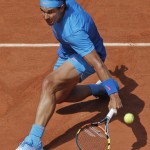 
              Spain's Rafael Nadal returns in the quarterfinal match of the French Open tennis tournament against Serbia's Novak Djokovic at the Roland Garros stadium, in Paris, France, Wednesday, June 3, 2015. (AP Photo/Christophe Ena)
            