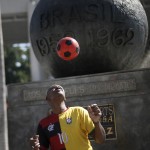 
              Marcio Pereira, 55, performs with a soccer ball as a way to earn a living, at the Maracana Stadium, in Rio de Janeiro, Brazil, Wednesday, May 27, 2015. Brazilian Jose Maria Marin, the former president of the Brazilian Football Confederation, was among seven high-ranking soccer officials arrested Wednesday in Zurich on U.S. charges of corruption. (AP Photo/Silvia Izquierdo)
            