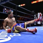 
              Shawn Porteri is knocked down by Adrien Broner during a welterweight fight on Saturday, June 20, 2015, in Las Vegas. Porter won by unanimous decision after a 12-round bout. (AP Photo/David Becker)
            