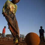
              Young boys play soccer on a dusty field in Thokoza township east of Johannesburg, South Africa, Thusday, May 28, 2015. The image of South Africa’s 2010 World Cup has been shattered by allegations that its bid over a decade ago was involved in bribes of more than $10 million to secure FIFA votes _ possibly with the knowledge or involvement of the South African government. (AP Photo/Themba Hadebe)
            