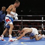 
              Sergey Kovalev knocks down Nadjib Mohammedi during their light heavyweight title boxing bout Saturday, July 25, 2015, in Las Vegas. (AP Photo/John Locher)
            