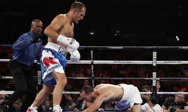Sergey Kovalev knocks down Nadjib Mohammedi during their light heavyweight title boxing bout Saturd...