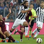 
              FILE - This is a Sunday, Oct. 5, 2014  file photo of Juventus' Andrea Pirlo  as her gets the ball past Roma' Francesco Totti during a Serie A soccer match at the Juventus stadium, in Turin, Italy. Italy playmaker Andrea Pirlo has joined Major League Soccer club New York City FC from Juventus. Juventus confirmed the news on its official Twitter account Monday July 6, 2015. (AP Photo/Massimo Pinca, File)
            
