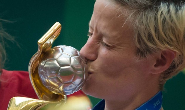 United States’ Megan Rapinoe kisses the trophy after defeating Japan to win the FIFA Women&#8...