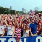
              Fans of U.S. Soccer are seen cheering after a goal by Carli Lloyd during the Women's World Cup final Sunday, July 5, 2015. The fans watched the action on a jumbo screen at a watch party in Chicago's Lincoln Park. (AP Photo/Teresa Crawford)
            