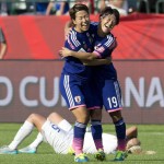 
              Japan's Azusa Iwashimizu and Saori Ariyoshi (19) celebrate the team's 2-1 win as England's Steph Houghton lies on the ground after a semifinal in the FIFA Women's World Cup soccer tournament, Wednesday, July 1, 2015, in Edmonton, Alberta, Canada. (Jason Franson/The Canadian Press via AP)
            