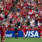 
              Canada's Christine Sinclair (12) runs the ball back to center field after scoring against England during first-half FIFA Women's World Cup quarterfinal soccer game action in Vancouver, British Columbia, Canada, on Saturday, June 27, 2015. (Darryl Dyck/The Canadian Press via AP) MANDATORY CREDIT
            