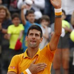 
              Serbia's Novak Djokovic celebrates after defeating Spain's Nicolas Almagro at the Italian Open tennis tournament, in Rome, Tuesday, May 12, 2015. Djokovic won 6-1, 6-7 (5), 6-3. (AP Photo/Riccardo De Luca)
            