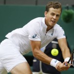 
              Vasek Pospisil of Canada returns a shot to  Andy Murray of Britain during the men's quarterfinal singles match at the All England Lawn Tennis Championships in Wimbledon, London, Wednesday July 8, 2015. (AP Photo/Kirsty Wigglesworth)
            