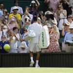 
              Novak Djokovic of Serbia signs autographs after winning the singles match against Bernard Tomic of Australia, at the All England Lawn Tennis Championships in Wimbledon, London, Friday July 3, 2015. (AP Photo/Kirsty Wigglesworth)
            