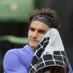 
              Switzerland's Roger Federer wipes his face during a break as he plays Colombia's Alejandro Falla during their first round match of the French Open tennis tournament at the Roland Garros stadium, Sunday, May 24, 2015 in Paris,  (AP Photo/David Vincent)
            