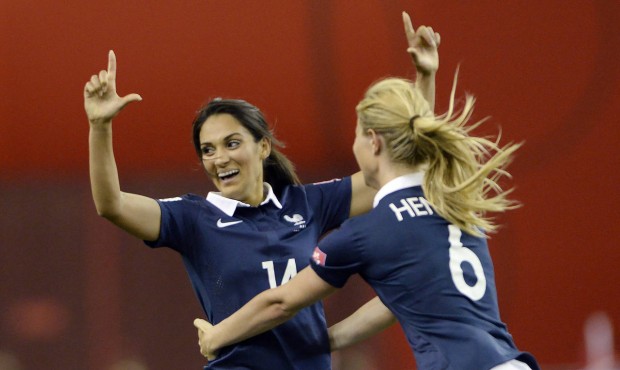 France’s Louisa Necib, left, celebrates her goal against Germany with teammate Amandine Henry...