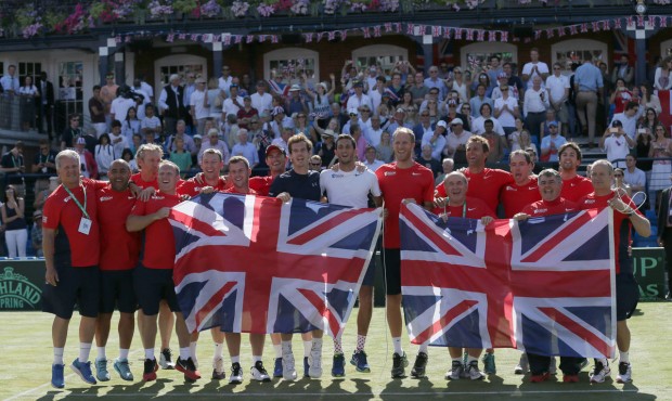 Britain’s Andy Murray, centre left, celebrates with his teammates after beating France’...