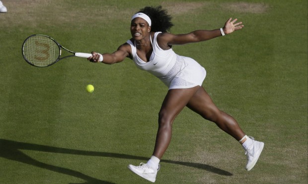 Serena Williams of the United States makes a return to Victoria Azarenka of Belarus during their si...