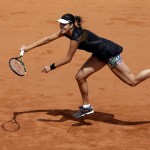 
              Serbia's Ana Ivanovic returns the ball to Ukraine's Elina Svitolina during their quarterfinal match of the French Open tennis tournament at the Roland Garros stadium, Tuesday, June 2, 2015 in Paris, France. (AP Photo/Thibault Camus)
            