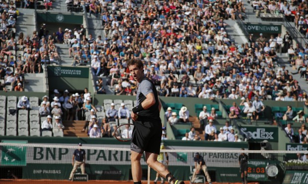 Britain’s Andy Murray screams after scoring a point in the quarterfinal match of the French O...
